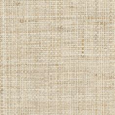 an upholstered beige fabric textured with small squares