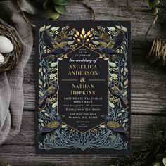 an ornate wedding card with birds and leaves on it, next to some eggshells