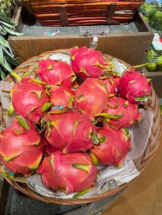 dragon fruit in a basket at a market