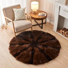 a living room with a chair, table and rug