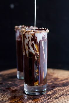 two glasses filled with ice cream and chocolate