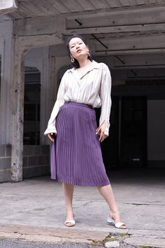 "Vintage high waist pleated skirt in a beautiful shade of lilac. It falls around the knees and has a zipper and snap button fastening. The model is 5'7 and size 8 (UK). MEASUREMENTS Waist: 61 cm / 24\" Hips: 91.5 cm / 36\" Length: 70 cm / 27.5\" In excellent condition. FREE UK SHIPPING on orders over £100 - use the code LUCKYUK at checkout." Purple Pleated Bottoms For Spring, Spring Purple Pleated Skirt, Elegant Purple Pleated Skirt, Chic Purple Pleated Skirt For Spring, Purple Flowy Pleated Skirt For Spring, Chic Pleated Purple Bottoms, Purple Relaxed Skirt For Workwear, Purple Lined Pleated Skirt For Spring, Purple Relaxed Skirt For Work