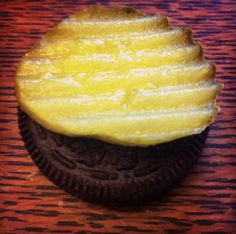 an oreo cookie sitting on top of a wooden table