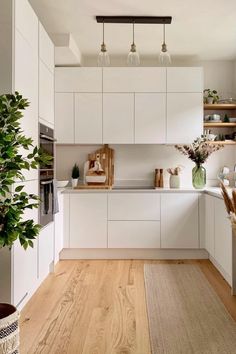 the kitchen is clean and ready for us to use it's natural wood flooring