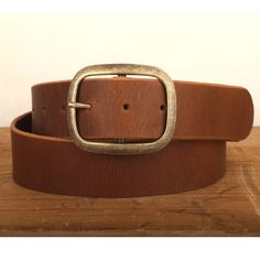 Our 100% Real Leather snap closure belts are handcrafted with lots of love right here in our studio, and the entire process is done by hand, and made to order. We use the finest full grain leather to produce our belts, and each one comes standard with a basic buckle. Please note: This is a handmade product made with natural materials so the color and finish may vary slightly from the image shown.Sizing:Please see our helpful size chart within the images of this listing. If you don't see your size in the chart we are able to create almost any custom size, just message us with you're exact waist measurement. This belt is 1.5" wide to fit standard belt loops, and works great with denim. If you need a different width, length, extra holes, or color request please reach out to us as we may be ab Vintage Brown Leather Retro Belt, Luxury Brown Belt With Smooth Grain, Rugged Brown Belt With Brass Buckle, Vintage Brown Belts With Rivets, Custom Belt Buckles, Vintage Brown Hand-tooled Belt Buckle, Custom Belt, Brown Leather Belt, Brown Belt