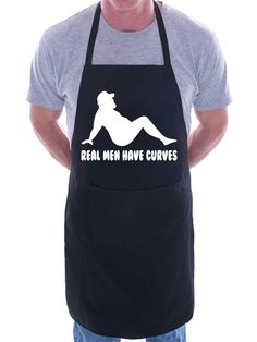 a man wearing an apron with the words real men have curves printed on it in white