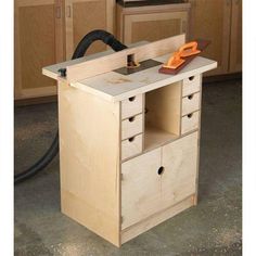 a workbench made out of plywood with tools on the top and drawers