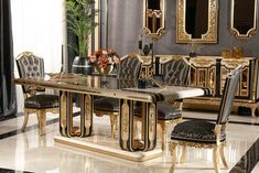 an elegant dining room with black and gold furniture