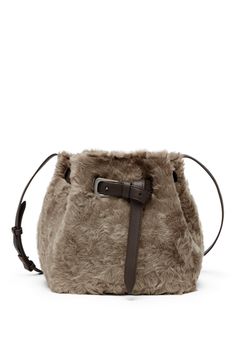 A refined French leather, Frosty Effect shearling showcases a wavy appearance with slightly uneven coloring: the finish gives the color a slight nuanced appearance. The reverse leather side is manufactured to have a very soft, velvety look. Magnetic snap closure Adjustable shoulder strap Detachable internal pochette with zipper All metal parts are Nickel-free Bag is 9,84" long, 6,30" wide and 9,45" high Elegant Evening Shoulder Bag With Faux Fur Lining, Leather Bag With Faux Fur Lining, Elegant Winter Shoulder Bag With Faux Fur Lining, Leather Evening Bags For Winter, Luxury Leather Shoulder Bag With Faux Fur Lining, Shearling Bag, Walker Shoes, Platform Slippers, Strap Top