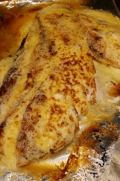 some food is cooking in a pan on the stove top and ready to be eaten