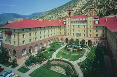 an aerial view of a large building in the mountains