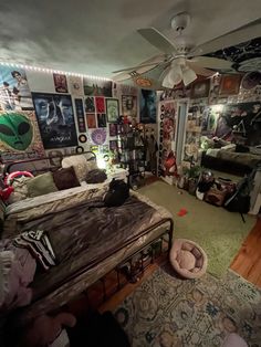 a bedroom with lots of pictures on the wall