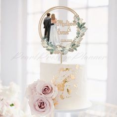 a wedding cake with a bride and groom topper