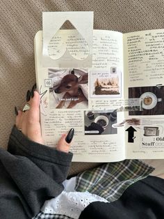 a person is reading a book with pictures on the pages and writing something in it