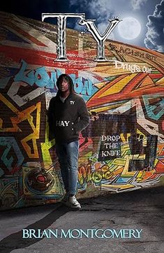 a man standing in front of a graffiti covered wall with the word ty on it