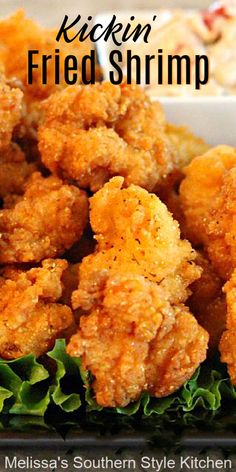 fried shrimp is piled high on top of lettuce in a white bowl with text overlay