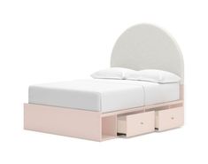 a bed with two drawers underneath it and a white headboard on top of the bed