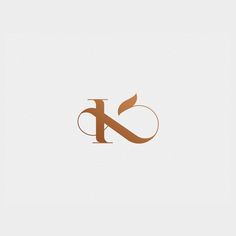 the letter k is made up of two letters and has leaves on top of it