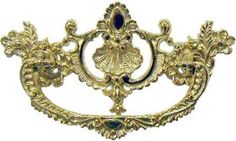 an ornate gold brooch with blue stones