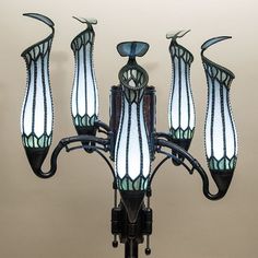 an art nouveau style chandelier with five lights