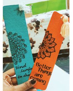 two bookmarks that say better things are coming and another one has an orange flower on it