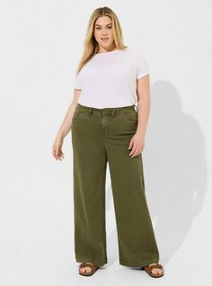 FIT High rise. . Roomy all the way down. Wide leg silhouette. 30” inseam. MATERIALS + CARE Cotton stretch twill woven fabric. . 96% lyocell, 4% spandex. Machine wash cold; line dry. Imported. . DETAILS Zip and button fly. Flat front. Front pockets. The best plus size women's long, tall wide leg high-rise chino pant pants in deep depths made of stretchtwill. Rock your look from Torrid to Festivals like Coachella and Lollapalooza, a concert, a show, or just for fun! Torrid is your destination for Plus Size Chinos Outfit, Disney Leggings, Shoes For Leggings, Ageless Style, Dress With Cardigan, Bottom Clothes, Way Down, Cozy Fall, Chinos Pants