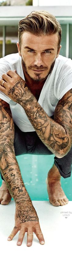 a man with many tattoos on his arms