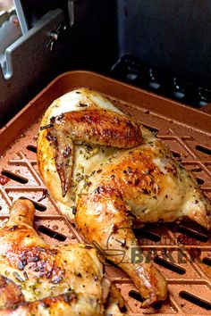 two whole chickens sitting on top of a grill