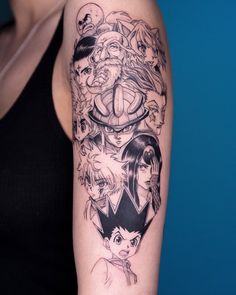 a woman's arm with tattoos on it and an anime character in the background