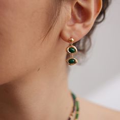 The setting is made of sterling silver, which is a popular metal choice for jewelry due to its durability and affordability. The sterling silver is then plated with a layer of gold, giving the earrings a luxurious and glamorous appearance. The gold plating adds warmth and richness to the overall design. Malachite is believed to offer emotional healing, protection from negative energies, and support personal transformation and growth. Chemical substances like perfumes, lotions, hairsprays, and cl Malachite Earrings, Black Onyx Earrings, Green Malachite, Malachite Stone, Onyx Earrings, Jewelry Lookbook, Black Agate, Earring Crafts, Swarovski Pearls