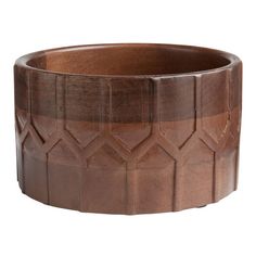 a wooden bowl with geometric designs on it