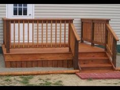 a wooden porch with steps leading up to it