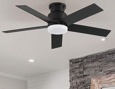 a black ceiling fan in a white room