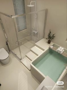 a bathroom with a glass enclosed shower stall and white tile flooring, along with a walk in tub