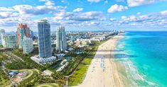 an aerial view of the beach and ocean in miami, florida with high rise buildings