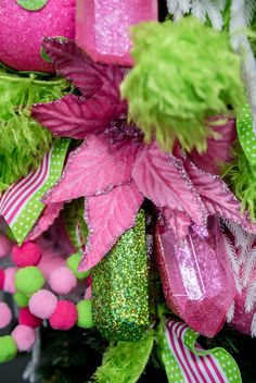 pink and green christmas decorations with poinsettia