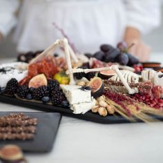 a table topped with lots of different types of food