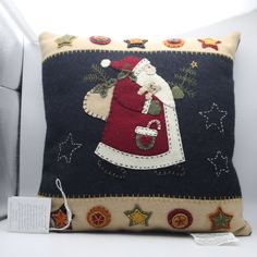 a decorative pillow with a santa clause on it