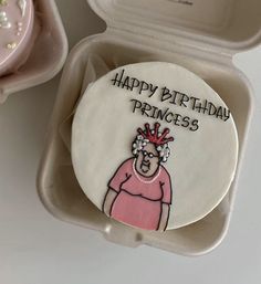 a decorated birthday cake in a box with the words happy birthday princess on it