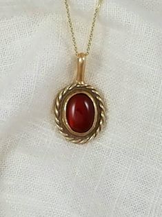 Hand-Crafted Ancient Bronze Pendant with a genuine 10x12 mm Carnelian stone.    Other stone options are available Approx Dimensions:  Length:  1 inch Width: 3/4 inch Total Length with loop: 1 1/4 inches Designed and Handcrafted by Randy from start to finish. Comes with a black adjustable cotton cord. Stones are natural and may vary in color.  Our pieces are made of solid jewelry grade ancient bronze and are not coated with any type of sealant that can chip off.   To keep your piece looking bright and shinny simply use a jewelry polishing cloth. Antique Oval Cabochon Gemstone Necklaces, Vintage Gemstone Necklace With Oval Cabochon, Carnelian Cabochon Round Pendant Jewelry, Formal Carnelian Oval Cabochon Jewelry, Carnelian Cabochon Jewelry For Anniversary, Formal Oval Cabochon Carnelian Jewelry, Round Carnelian Necklaces With Polished Finish, Carnelian Gemstone Oval Pendant Jewelry, Polished Carnelian Necklaces