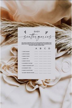 a baby scatterer is laying on top of a blanket with the word, baby scatterers written in cursive writing