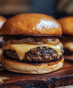 a cheeseburger on a wooden cutting board