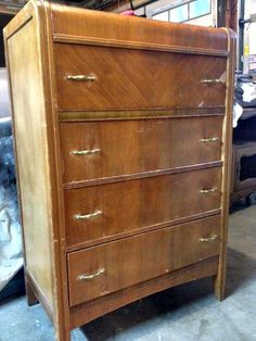 an old wooden dresser is being worked on