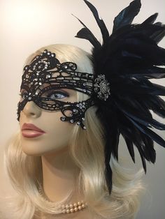 "Black Lace Masquerade Mask with Feathers and Crystals, Women's Lace Mask, Masked Ball, Wedding Masquerade Masks, Bridal Wedding Mask Beware of cheap imitations that use glue! This is an original design by IceGreenEyes. Stiffened and lace mask will not sweat your face like the cheap plastic ones. The mask is also shaped so you have lots of room around the eyes instead of a skinny slice. These masks are hand stitched, not held together with sticky glue that will heat up and fall apart before the Black Masquerade Mask For Wedding Carnival, Elegant Fitted Masquerade Mask For Mardi Gras, Black Wedding Headpiece For Carnival, Glamorous Fitted Wedding Headpiece, Elegant Fitted Masquerade Mask For Costume Party, Wedding Masquerade Mask With Rhinestones, Adjustable Masquerade Mask For Wedding Carnival, Elegant Masquerade Mask For Party, Elegant Fitted Masquerade Mask For Party