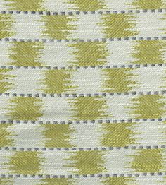 a green and white pattern on fabric