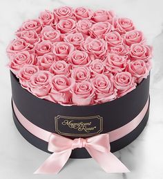 a black box with pink roses in it