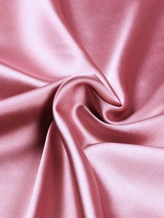 Indulge in the luxurious feel of this 58"/60" wide (147/152 cm) Silk Skin Duchess fabric, also known as Peau de Soie. Its dull satin finish and lightweight drape make it a perfect choice for creating elegant bridesmaid dresses, formal gowns, or any special occasion attire. With a subtle sheen and smooth texture, this high-quality silk fabric offers a sophisticated look and feel. Whether you're a professional dressmaker or an avid sewing enthusiast, this versatile material will elevate your projects with its timeless beauty and exceptional craftsmanship. Elevate your sewing experience and create stunning garments that will turn heads with this premium Silk Skin Duchess fabric. Luxurious Fabric: Crafted from exquisite peau de soie silk, this fabric offers a dull satin finish and a smooth, su Dusty Rose Satin Dress, Pink Leather Fabric, Pink Silk Sheet, Silk Fabric Texture, Duchess Fabric, Satin Fabric Texture, Pink Silk Fabric, Pink Silk Dress, Bridesmaid Dresses Formal