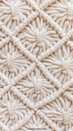 the crochet pattern is made with white yarn and has an intricate design on it