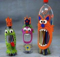 three different colored toothbrushes in plastic bottles with faces on them and mouths sticking out