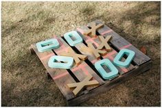 the letters are made out of wood and have been placed on top of each other